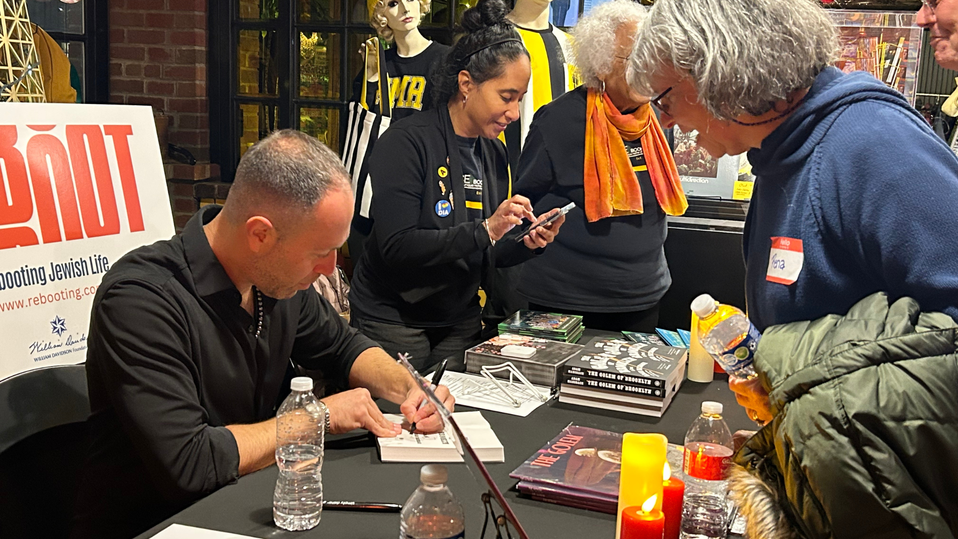Author Adam Mansbach signs copies of his new book.